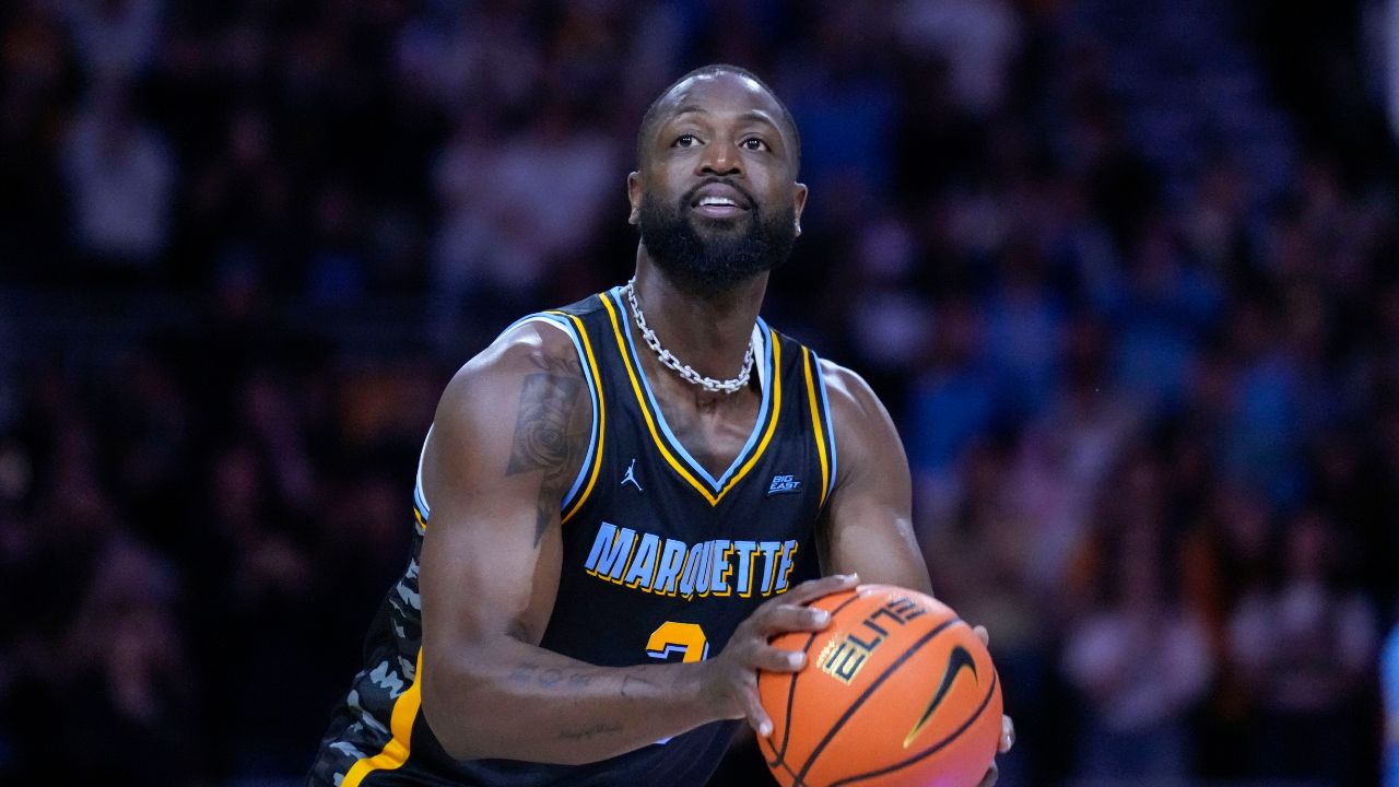Former Marquette Golden Eagles player Dwyane Wade shoots during a timeout during the first half of the game against the Providence Friars at Fiserv Forum.