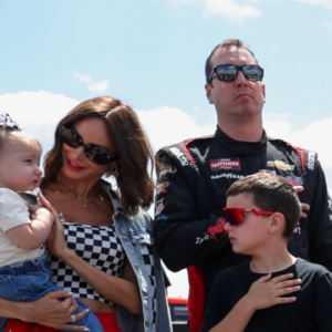 NASCAR Craftsman Truck Series driver Kyle Busch stands with his wife Samantha Busch and children Brexton and Lennix prior to the CRC Brakleen 150 at Pocono Raceway.
