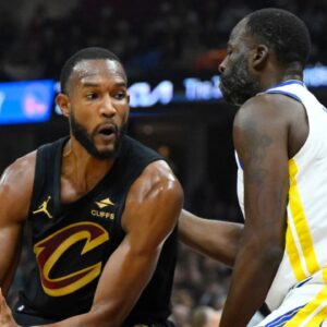 Golden State Warriors forward Draymond Green (23) defends Cleveland Cavaliers forward Evan Mobley (4) in the first quarter at Rocket Mortgage FieldHouse.