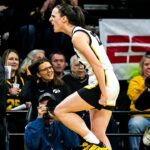 Iowa guard Caitlin Clark reacts after drawing a foul during a NCAA Big Ten Conference women's basketball game against Indiana