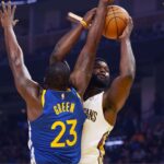 New Orleans Pelicans forward Zion Williamson (1) has his shot blocked by Golden State Warriors forward Draymond Green (23) in the first quarter at Chase Center.
