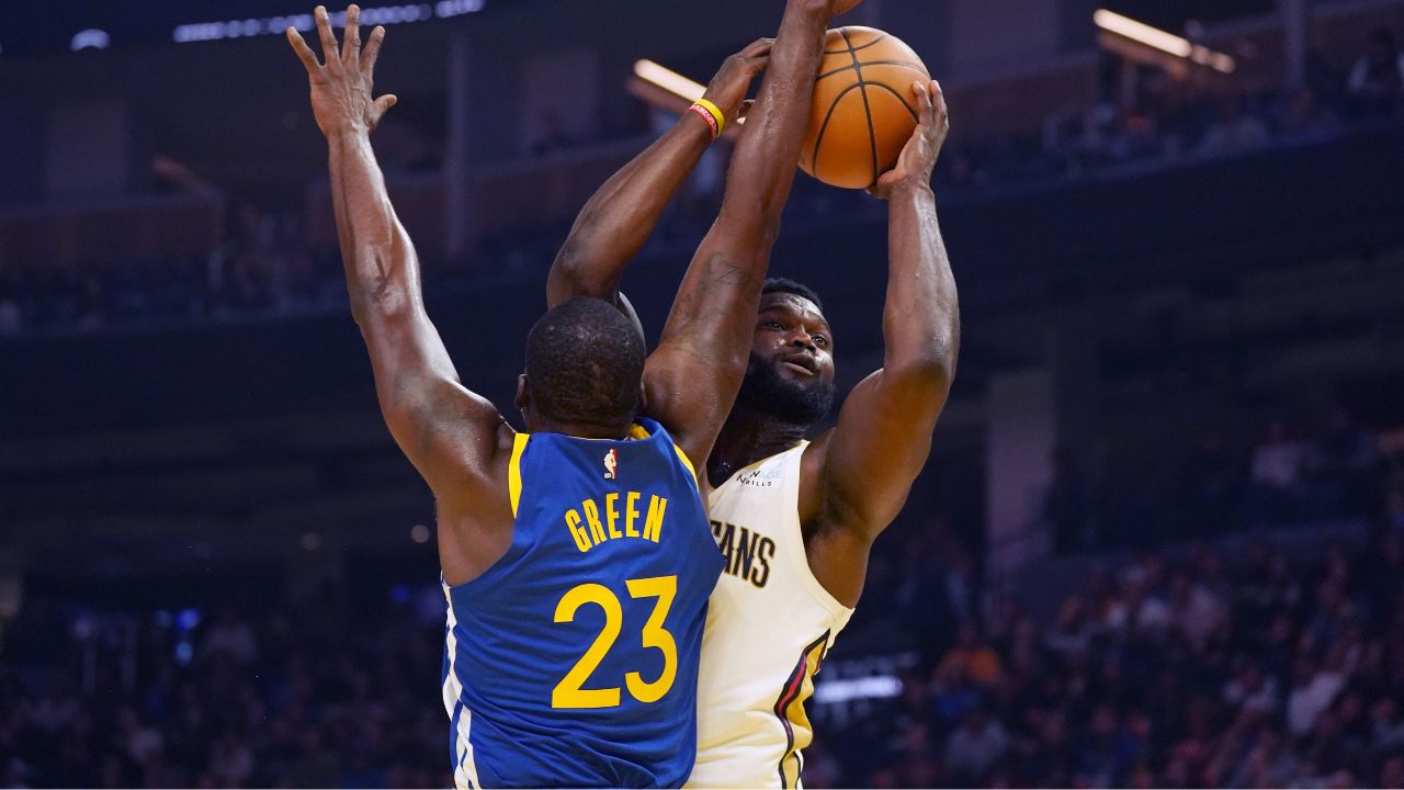 New Orleans Pelicans forward Zion Williamson (1) has his shot blocked by Golden State Warriors forward Draymond Green (23) in the first quarter at Chase Center.