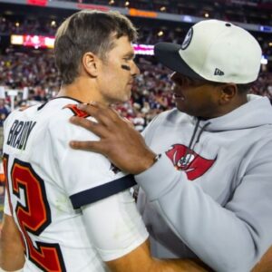 Tampa Bay Buccaneers quarterback Tom Brady (12) celebrates with offensive coordinator Byron Leftwich after defeating the Arizona Cardinals in overtime at State Farm Stadium.