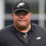 Philadelphia Eagles head of security Dom DiSandro walks the sideline before a game against the New England Patriots at Gillette Stadium.