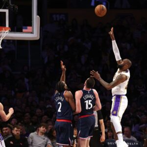 Los Angeles Lakers forward LeBron James (23) shoots against LA Clippers forward Drew Eubanks (15) and forward Kawhi Leonard (2) during the fourth quarter at Crypto.com Arena