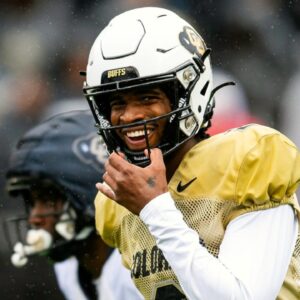 Colorado's Shedeur Sanders smiles before taking a snap during a Colorado football spring game at Folsom Field in Boulder, Colo., on Saturday, April 27, 2024.
