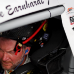 Jul 20, 2024; Hampton, VA, USA; Dale Earnhardt Jr. waits in his car during qualifying for the 16th Annual Hampton Heat at Langley Speedway. Mandatory Credit: Peter Casey-Imagn Images