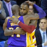 Cleveland Cavaliers forward LeBron James (23) hugs Los Angeles Lakers forward Kobe Bryant (24) near the end of the Cavaliers' 120-111 win at Quicken Loans Arena.