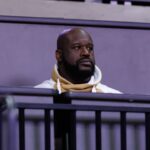 Former NBA player Shaquille O'Neal sits courtside during the first half between the Florida Gators and the LSU Tigers at Exactech Arena at the Stephen C. O'Connell Center