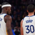 Golden State Warriors forward Jimmy Butler III (10) talks with guard Stephen Curry (30) during a game against the Detroit Pistons in the second quarter at Chase Center