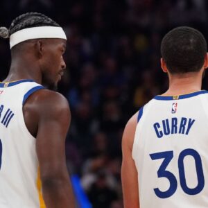 Golden State Warriors forward Jimmy Butler III (10) talks with guard Stephen Curry (30) during a game against the Detroit Pistons in the second quarter at Chase Center