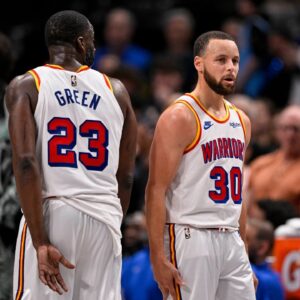 Golden State Warriors forward Draymond Green (23) and guard Stephen Curry (30) during the game between the Dallas Mavericks and the Golden State Warriors at the American Airlines Center