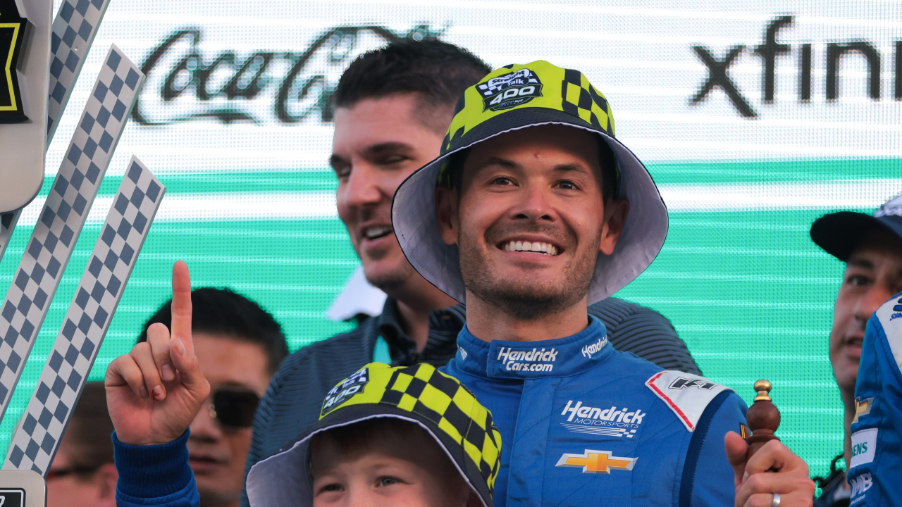 NASCAR Cup Series driver Kyle Larson (5) celebrates with his son after winning the Straight Talk Wireless 400 at Homestead-Miami Speedway.
