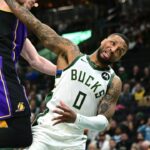 Milwaukee Bucks guard Damian Lillard (0) is fouled by Los Angeles Lakers forward Dalton Knecht (4) in the second quarter at Fiserv Forum.