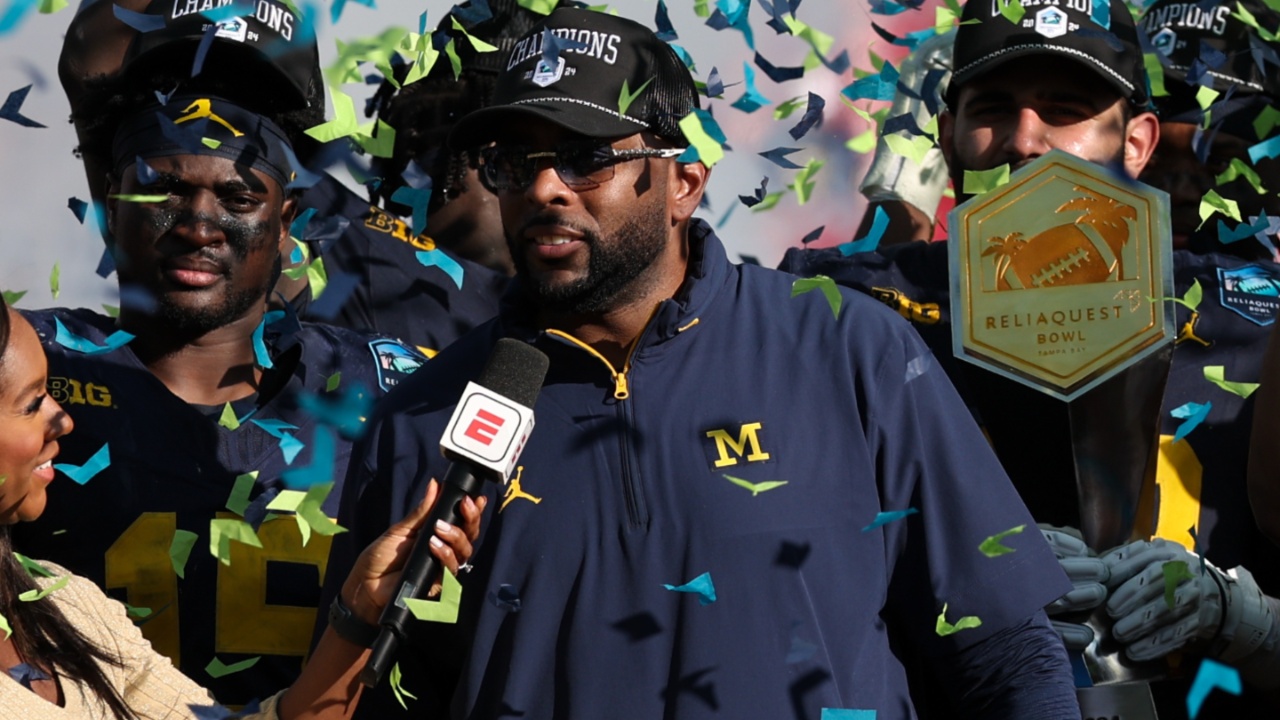 Dec 31, 2024; Tampa, FL, USA; Michigan Wolverines head coach Sherrone Moore celebrates after beating the Alabama Crimson Tide in the ReliaQuest Bowl at Raymond James Stadium.