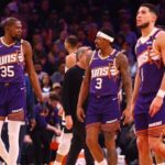 Phoenix Suns forward Kevin Durant (35) with guard Bradley Beal (3) and Devin Booker (1) against the Minnesota Timberwolves at Footprint Center.