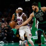 Boston Celtics forward Jayson Tatum (0) tries to steal the ball from Philadelphia 76ers guard Patrick Beverley (22) during the second quarter at TD Garden.