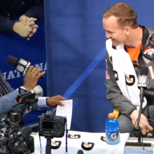 Jan 28, 2014; Newark, NJ, USA; Denver Broncos quarterback Peyton Manning is interviewed by NFL Network analyst Deion Sanders during Media Day for Super Bowl XLIII at Prudential Center.