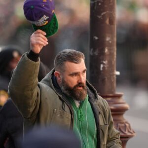 Jason Kelce gestures to fans during the Super Bowl LIX championship parade and rally.