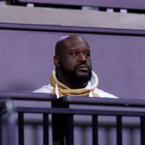 Former NBA player Shaquille O'Neal sits courtside during the first half between the Florida Gators and the LSU Tigers at Exactech Arena at the Stephen C. O'Connell Center