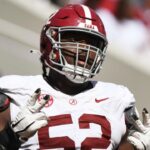 Alabama offensive lineman Tyler Booker (52) celebrates after the offense scored a touchdown during the A-Day scrimmage at Bryant-Denny Stadium.