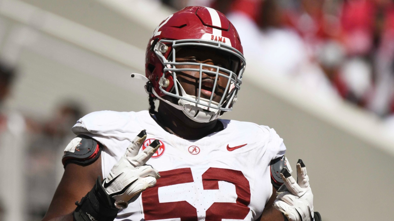 Alabama offensive lineman Tyler Booker (52) celebrates after the offense scored a touchdown during the A-Day scrimmage at Bryant-Denny Stadium.