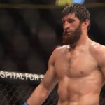 Magomed Ankalaev (blue gloves) reacts during the fight against Jan Blachowicz (red gloves) during UFC 282 at T-Mobile Arena.