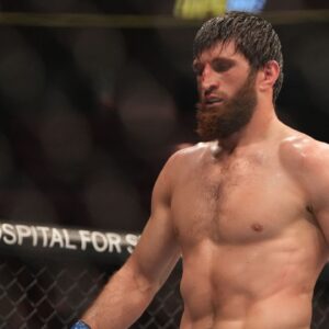Magomed Ankalaev (blue gloves) reacts during the fight against Jan Blachowicz (red gloves) during UFC 282 at T-Mobile Arena.