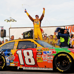 Mar. 1, 2009; Las Vegas, NV, USA; NASCAR Sprint Cup Series driver Kyle Busch celebrates after winning the Shelby 427 at Las Vegas Motor Speedway. Mandatory Credit: Mark J. Rebilas-Imagn Images