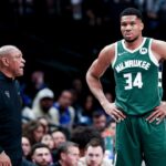 Milwaukee Bucks head coach Doc Rivers speaks to Milwaukee Bucks forward Giannis Antetokounmpo (34) during the second half against the Dallas Mavericks at American Airlines Center.