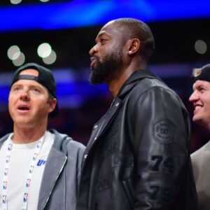 Utah Jazz minority owner Dwyane Wade with majority owner Ryan Smith (left) watch game action against the Los Angeles Lakers during the second half at Crypto.com Arena