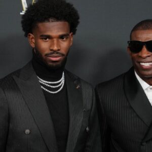 Deion Sanders (right) with his son Shedeur Sanders on the red carpet before Super Bowl LIX NFL Honors at Saenger Theatre.
