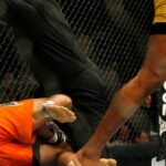 UFC middleweight champion Anderson Silva (black) and Rich Franklin (orange) face off in their 5 round bout at the US Bank Arena in Cincinnati, OH. Silva retained his title via 2nd round stoppage due to strikes.