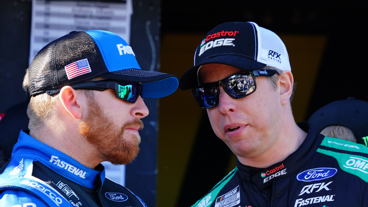 NASCAR Cup Series driver Brad Keselowski (6) and driver Chris Buescher (17) talk during driver introductions before the Daytona 500 at Daytona International Speedway.