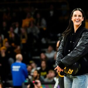 Caitlin Clark reacts during a video featuring clips submitted by fans during her jersey retirement ceremony Sunday, Feb. 2, 2025 at Carver-Hawkeye Arena in Iowa City, Iowa.