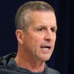Baltimore Ravens coach John Harbaugh speaks during the NFL Scouting Combine at the Indiana Convention Center.