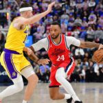 Austin Reaves (L) and Norman Powell (R)