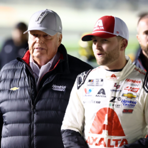 Feb 14, 2024; Daytona Beach, Florida, USA; NASCAR Cup Series driver William Byron (24) and Rick Hendrick (left) walk on pit row during qualifying for the Daytona 500 at Daytona International Speedway. Mandatory Credit: Mark J. Rebilas-Imagn Images