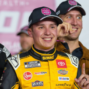 Christopher Bell (20) poses with his trophy in Victory Lane after claiming a victory at Atlanta Motor Speedway.