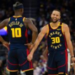 Golden State Warriors forward Jimmy Butler III (10) and guard Stephen Curry (30) share a laugh during the second quarter against the Sacramento Kings at Chase Center.