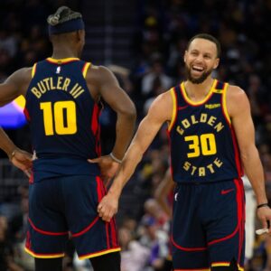Golden State Warriors forward Jimmy Butler III (10) and guard Stephen Curry (30) share a laugh during the second quarter against the Sacramento Kings at Chase Center.