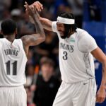 Dallas Mavericks forward Anthony Davis (3) and guard Kyrie Irving (11) celebrates after Davis dunks the ball during the second quarter against the Houston Rockets at American Airlines Center.