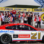 Mar 16, 2025; Las Vegas, Nevada, USA; NASCAR Cup Series driver Josh Berry (21) poses for photos following his victory of the Pennzoil 400 at Las Vegas Motor Speedway. Mandatory Credit: Gary A. Vasquez-Imagn Images