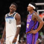 Minnesota Timberwolves guard Anthony Edwards (5) and Phoenix Suns guard Bradley Beal (3) talk during the second half at Footprint Center.