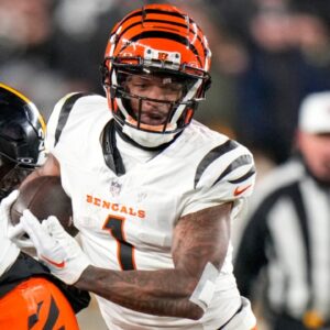 Cincinnati Bengals wide receiver Ja'Marr Chase (1) runs with a catch in the fourth quarter of the NFL Week 18 game between the Pittsburgh Steelers and the Cincinnati Bengals at Acrisure Stadium in Pittsburgh on Saturday, Jan. 4, 2025. The Bengals won 19-17 to finish the regular season at 9-8.