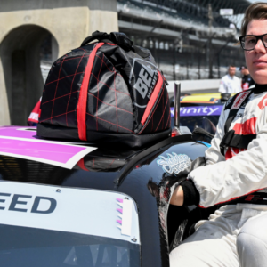 NASCAR Xfinity Series driver Sheldon Creed (18) climbs into his car Saturday, July 20, 2024, during qualifying for the Pennzoil 250 at Indianapolis Motor Speedway.