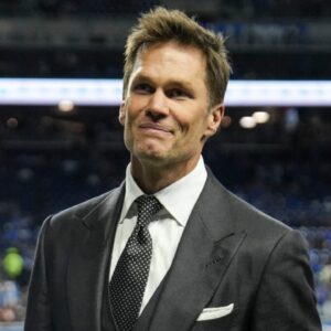 Tom Brady acknowledges fans as he walks into the tunnel before the NFC divisional round between Detroit Lions and Washington Commanders at Ford Field in Detroit on Saturday, Jan. 18, 2025.