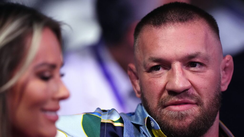 IBF Heavyweight Title Fight - Wembley Stadium Conor McGregor and Dee Devlin in the stands at Wembley Stadium, London.