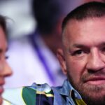 IBF Heavyweight Title Fight - Wembley Stadium Conor McGregor and Dee Devlin in the stands at Wembley Stadium, London.