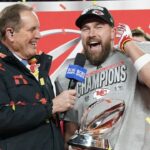 Jan 26, 2025; Kansas City, MO, USA; Kansas City Chiefs tight end Travis Kelce (87) speaks to the media after being presented with the Lamar Hunt Trophy after the AFC Championship game against the Buffalo Bills at GEHA Field at Arrowhead Stadium.